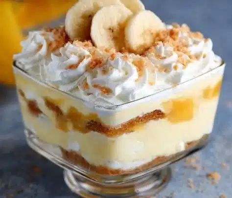 Banana Pudding 6 Delicious banana pudding served in a glass dish with banana slices and whipped cream
