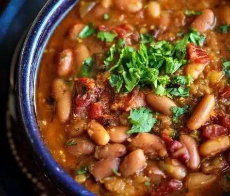 Charro Beans 9 Bowl of delicious Charro Beans with spices and garnishes