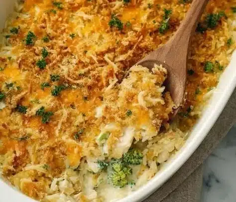 Homemade chicken rice casserole topped with cheese and herbs