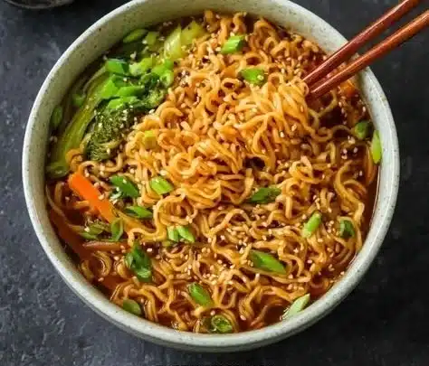 Delicious bowl of comforting ramen noodles topped with fresh ingredients.