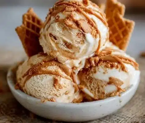 Bowl of homemade ice cream with caramel swirls on top