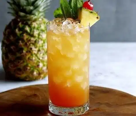 Ultimate Mai Tai 3 Delicious Mai Tai cocktail served with garnishes and ice in a tropical setting