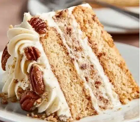 Delicious homemade Butter Pecan Cake with nuts and creamy frosting