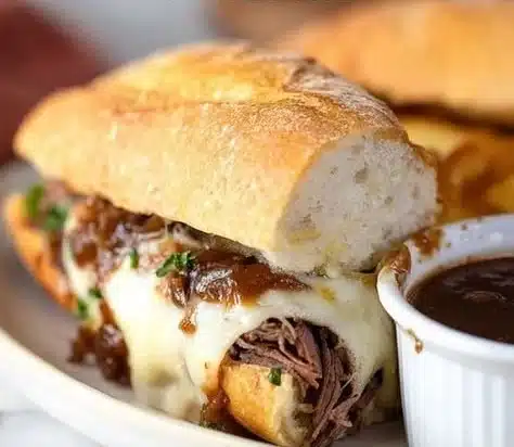 Crock Pot French Dip Sandwiches served with au jus for dipping