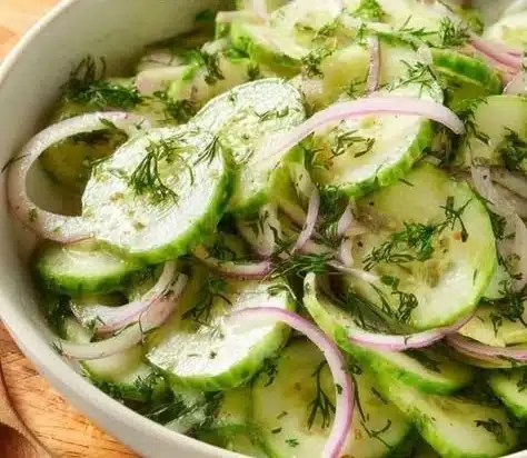 Fresh and crunchy cucumber salad with herbs and dressing