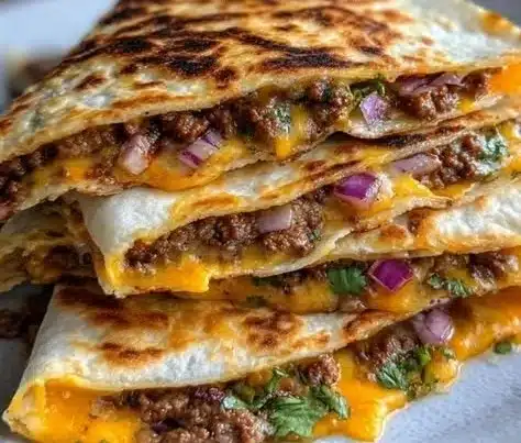 Delicious homemade smashburger quesadillas served on a plate