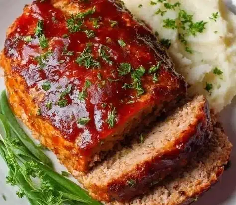 Moist and juicy turkey meatloaf slice on a plate